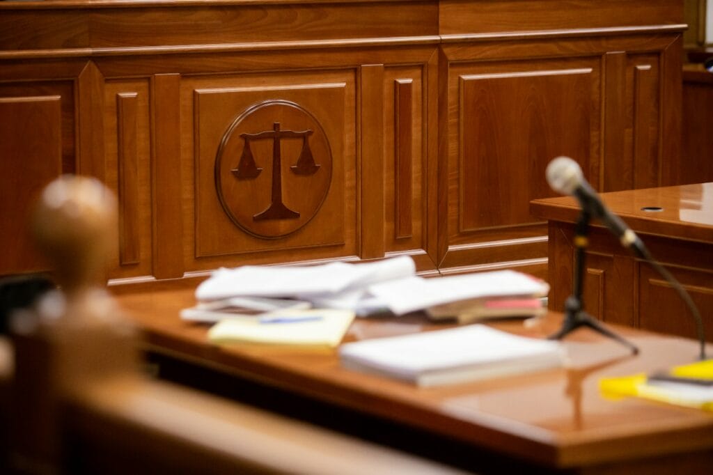 Empty prosecutor's desk in courtroom