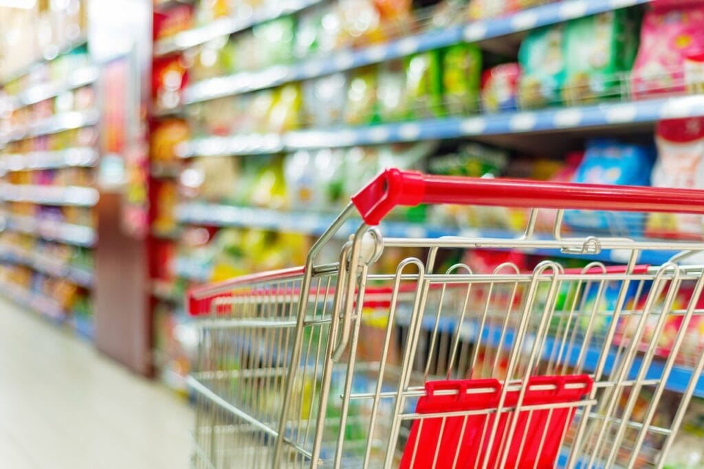 Grocery cart in a grocery aisle