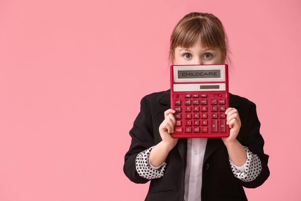 Female child holding a calculator indicative of the high costs of Wisconsin childcare.